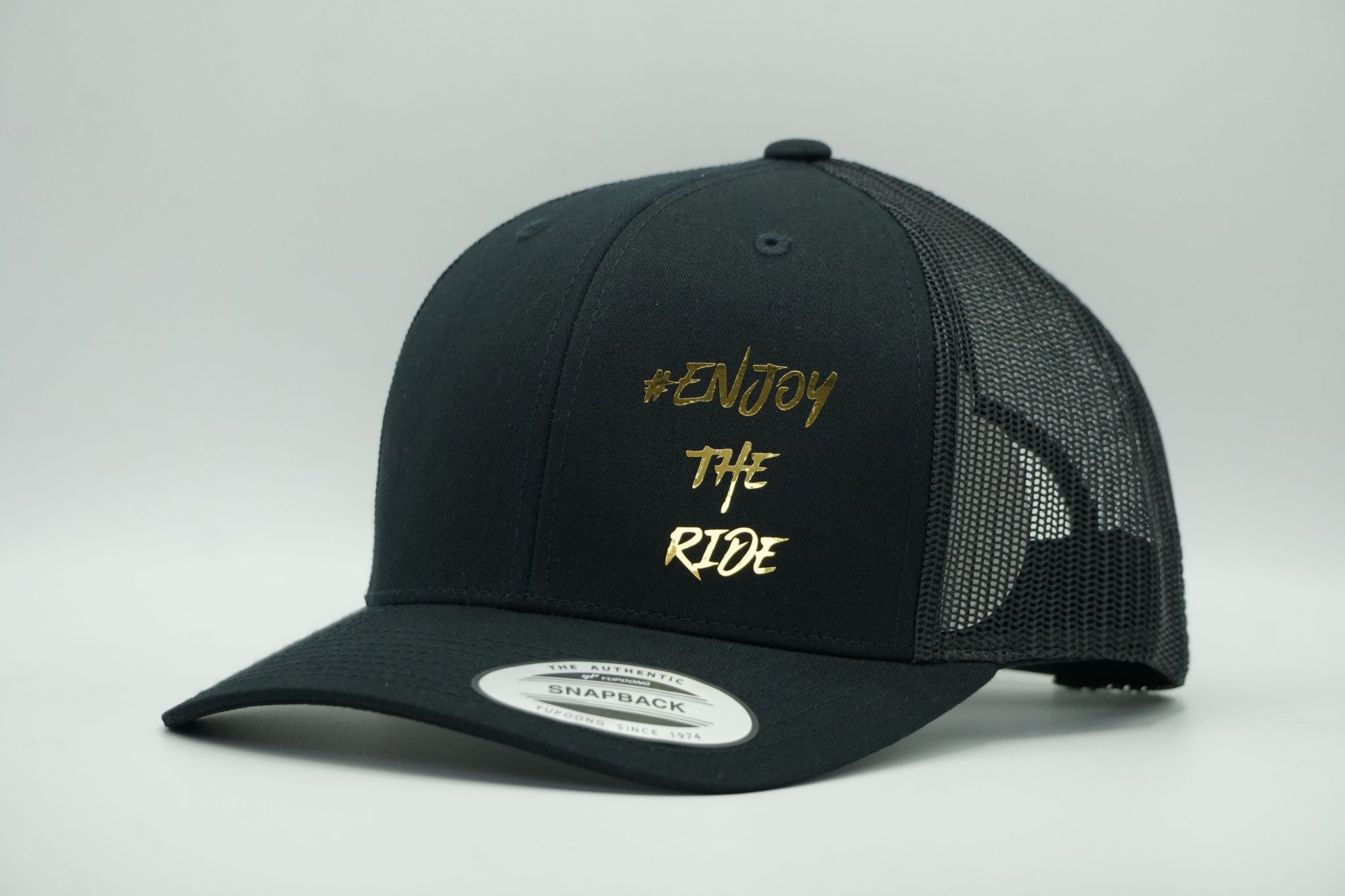 #EnjoyTheRide Black Flexfit Retro Trucker Cap (The Gold One)